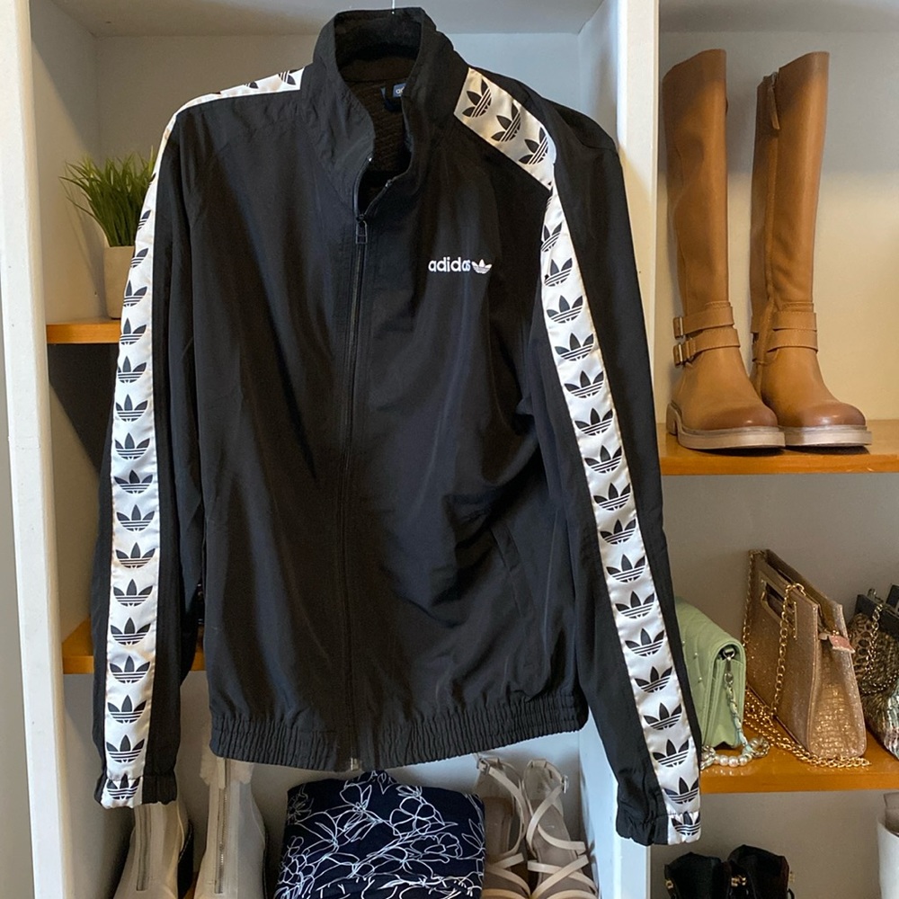 Adidas Jacket. Size Medium. Logo lace down arms and logo at back and front.